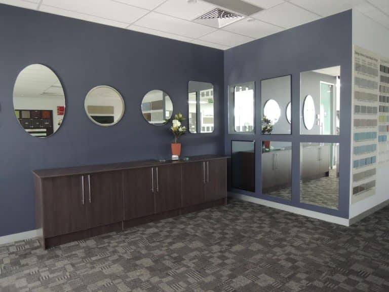Large commercial mirror wall installation by Design Inferno Glass