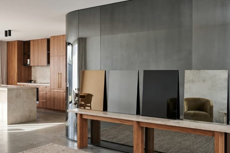 Bronze, smoked grey, black and antique tinted mirror glass samples displayed in a modern Australian interior.