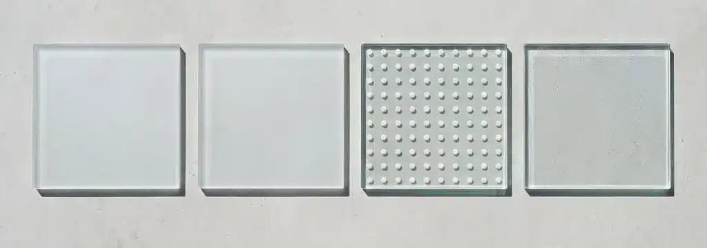 Four anti-slip glass finishes compared: sandblasted, acid etched, ceramic frit dots and coated