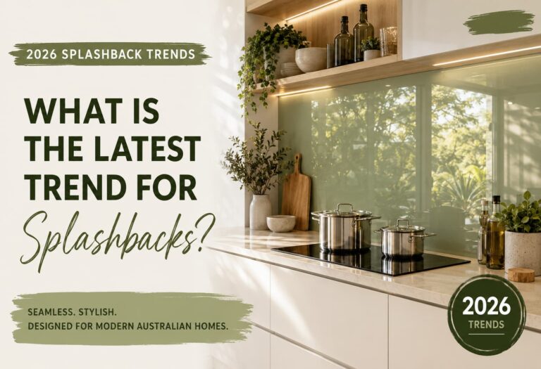 Modern kitchen with a full-height sage-green glass splashback behind the cooktop